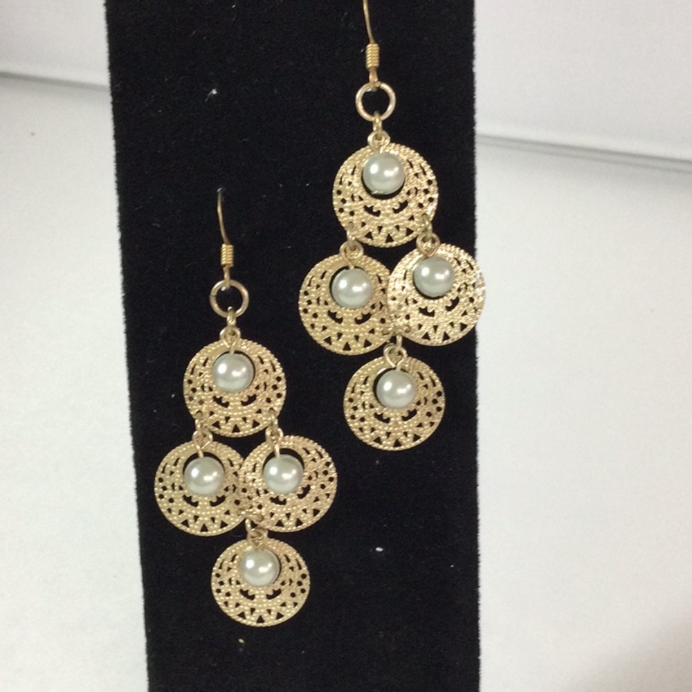 Gold dangle earrings with faux pearls.